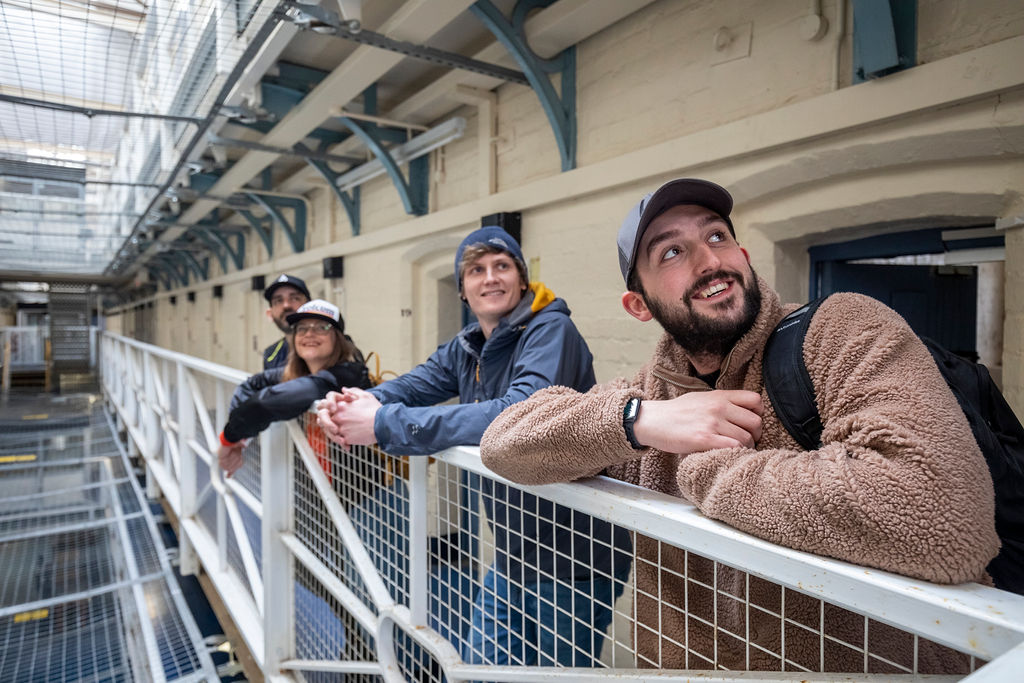 Visitors experiencing the atmosphere in one of the prison wings | Shepton Mallet Prison